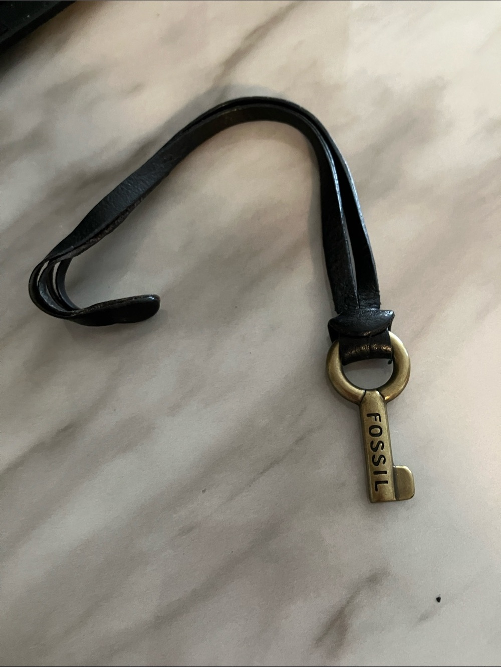 Brass Tone Key FOB circa 2000s Fossil (smaller size) black leather strap